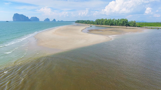 Aerial shot at tropical sea with long tail boat in south thailand