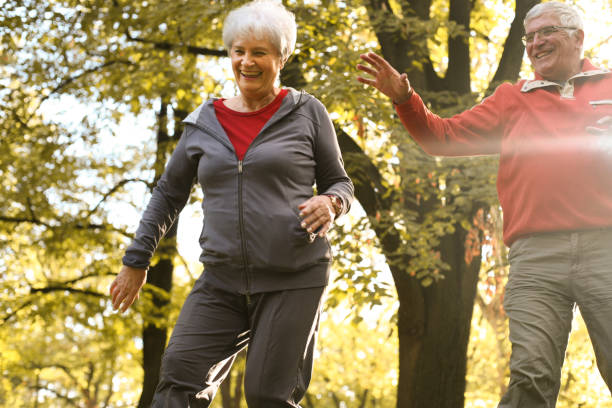 istock Active senior couple together in park having fun. 861651758