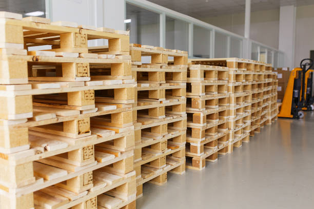 istock few empty wooden pallets for storage in an empty warehouse. 861651854