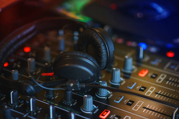 istock DJ mixer in bright colors disco in a nightclub. 861652226