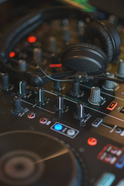 DJ mixer in bright colors disco in a nightclub. Audio equipment musician in a restaurant or cafe - a mixer for sound effects and music playback.