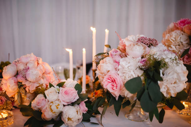 istock Table decor with white flowers and candles for a wedding party 861652384