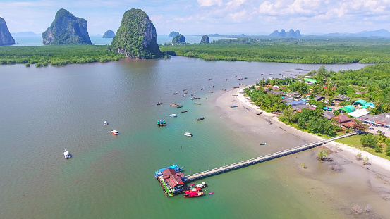 Aerial view  at tropical sea with long tail boat in south thailand