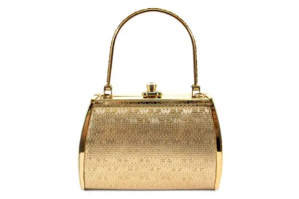 Woman gold handbag isolated on white background.Gold handbag isolated