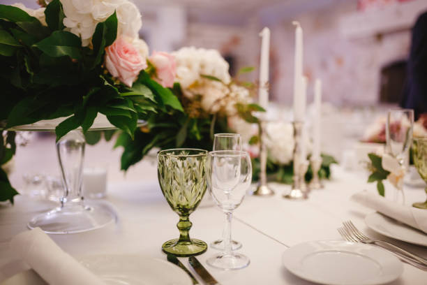 istock Table decor with white flowers and candles for a wedding party 861654956