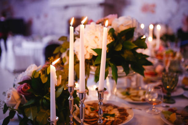 istock Table decor with white flowers and candles for a wedding party 861655234