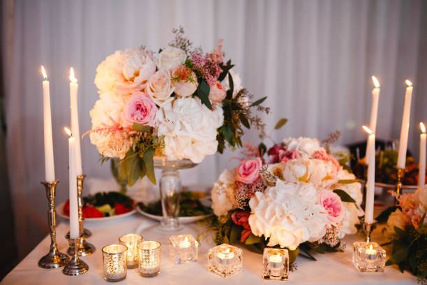 istock Table decor with white flowers and candles for a wedding party 861655484