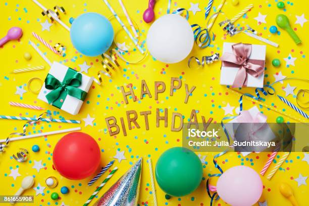 Happy Birthday Background Or Greeting Flyer Colorful Holiday Supplies On Yellow Table Top View Flat Lay Style Stock Photo - Download Image Now