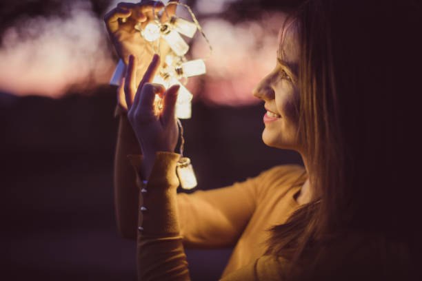 istock Woman outdoors with lights 861659550