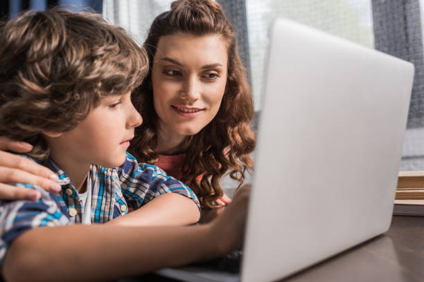 istock family with laptop at home 861670854