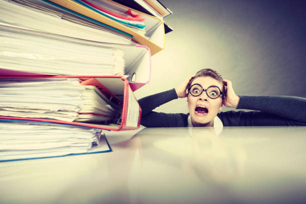 istock Accountant terrified of pils of binders. 861678180