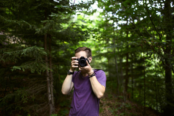 istock Man taking photo  in the forest 861681690