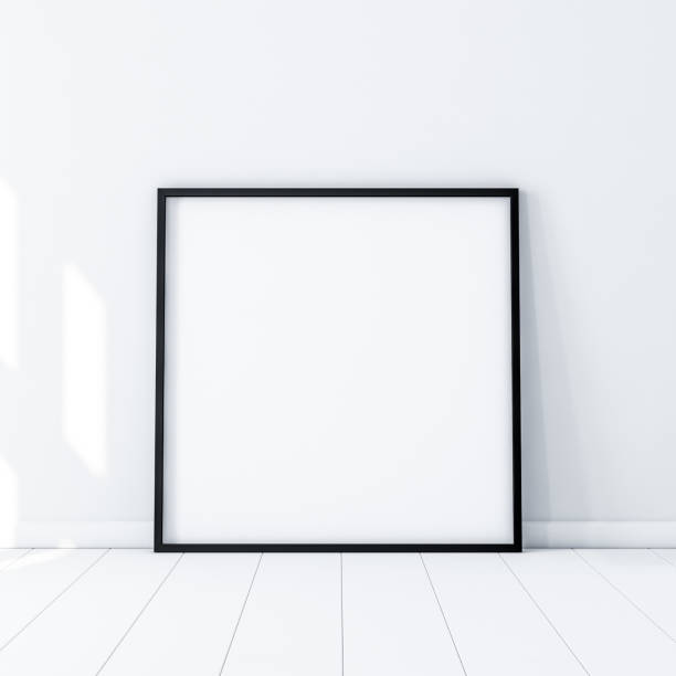 istock Square Poster with Black Frame Mockup standing on the floor in white room 861684662
