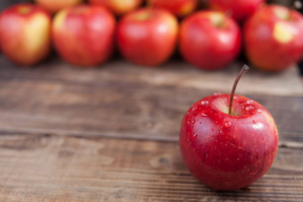 istock Red apples on a dark wooden table 861684732