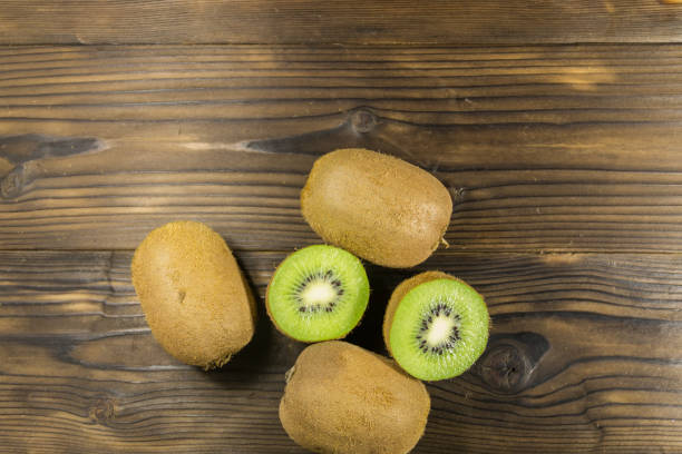 istock Kiwi fruits on wooden table 861687578