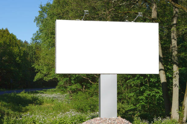 istock horizontal blank billboard on the background of green trees, mock up 861688762