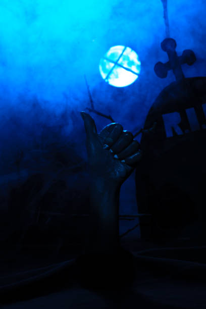 istock Dead hand giving thumb up against tombstone 861691568