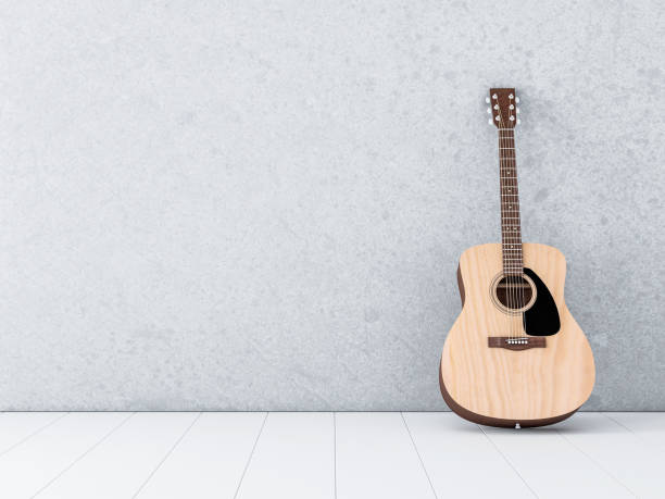 istock Acoustic Guitar Standing near concrete wall in white empty room 861692030