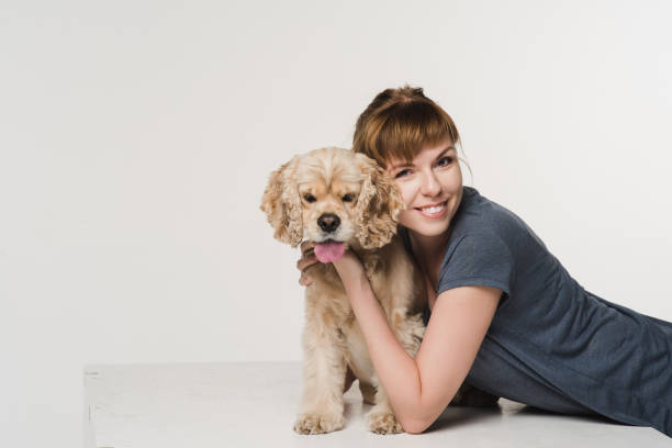 istock Young woman hugging her spaniel 861728394