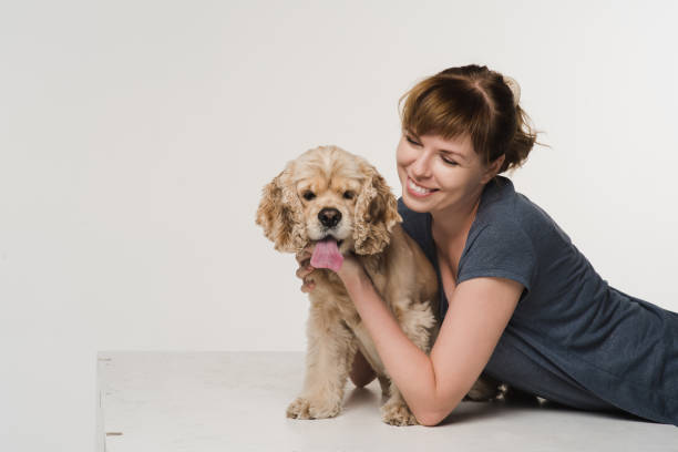 istock Young woman hugging her spaniel 861728416