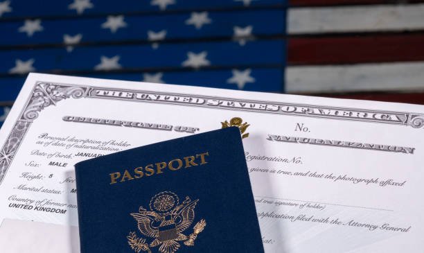 istock USA passport and naturalization certificate over US Flag 861732182