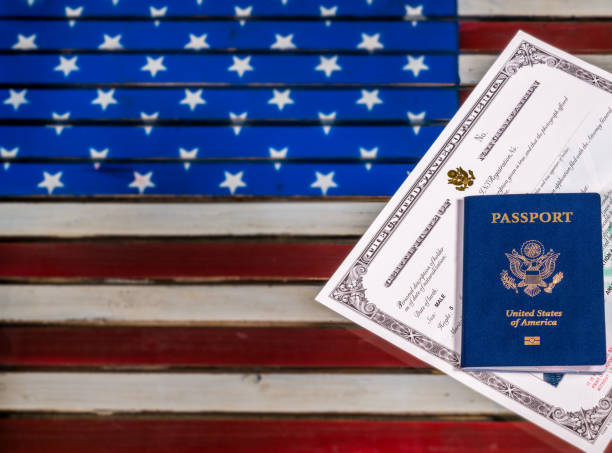istock USA passport and naturalization certificate over US Flag 861732244