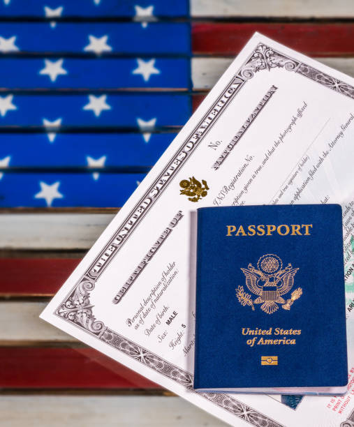 istock USA passport and naturalization certificate over US Flag 861732350