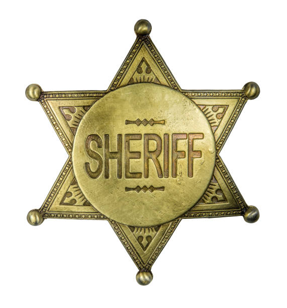 Isolated Vintage Sheriff Badge Isolated Retro Vintage Brass Sheriff Star Badge On A White Background sheriff badge star shape gold stock pictures, royalty-free photos & images