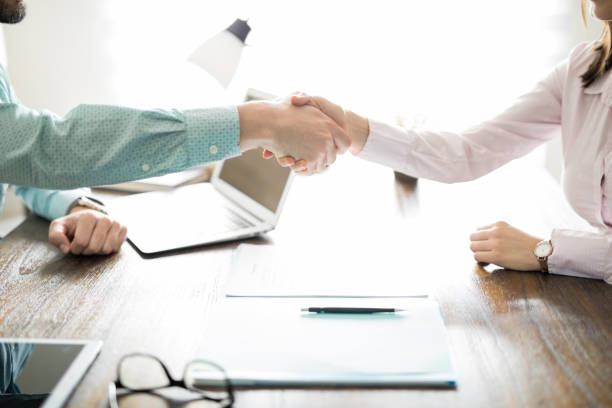istock Handshake of a man and woman 861735156