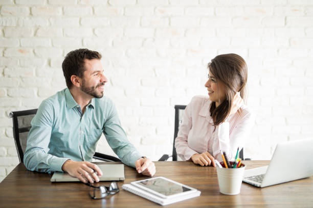 istock Cute woman talking to her coworker 861739414