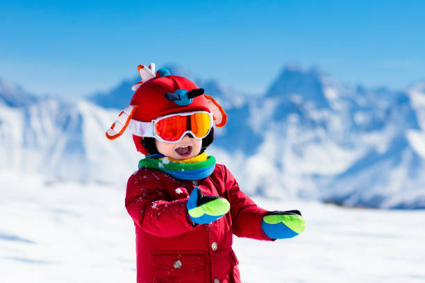 Kids winter snow sport. Children ski. Family skiing. Child skiing in the mountains. Kid in ski school. Winter sport for kids. Family Christmas vacation in the Alps. Children learn downhill skiing. Alpine ski lesson for boy or girl. Outdoor snow fun. chamonix photos stock pictures, royalty-free photos & images