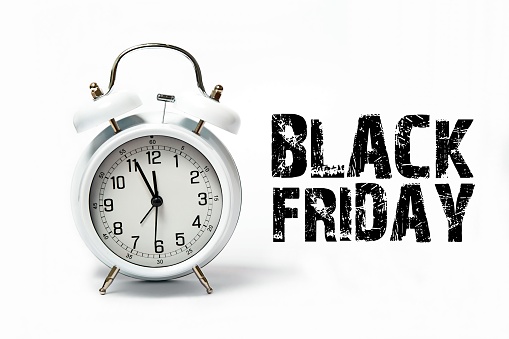OLd white clock with text black Friday