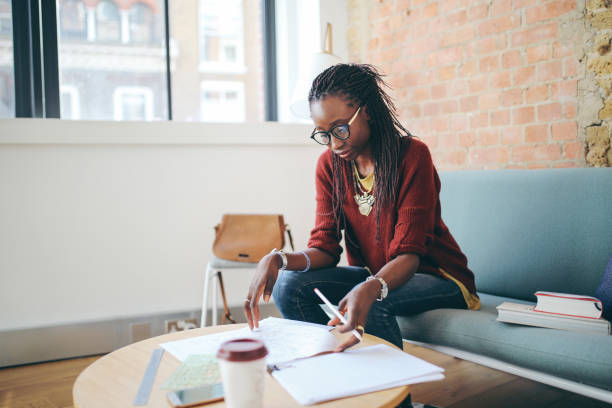 istock Young women working in her apartment 861769338