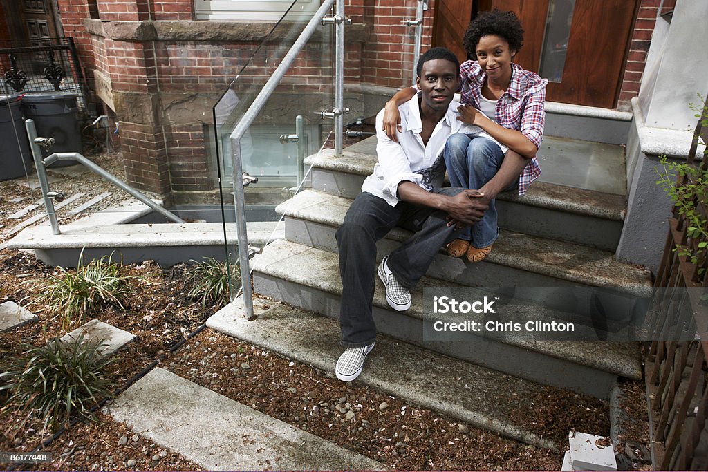 Couple in front of row-house  African-American Ethnicity Stock Photo