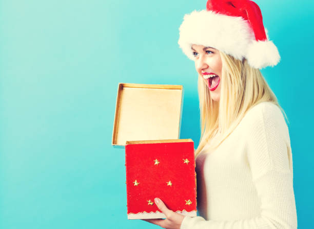 istock Happy young woman with Christmas present box 861791532