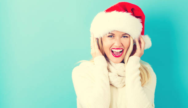 istock Happy young woman with Santa hat 861791586