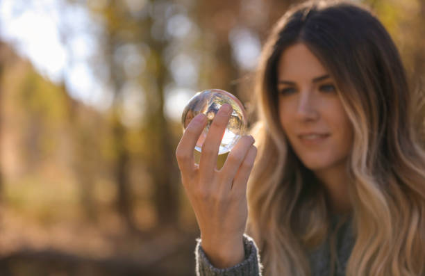 istock Woman looking into glass ball 861795078