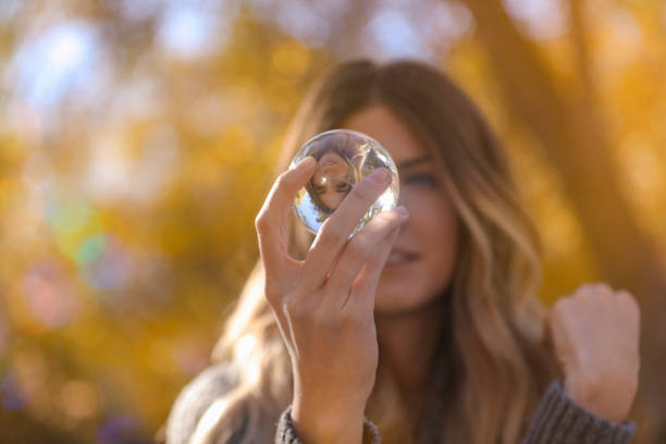 istock Woman looking into glass ball 861795088