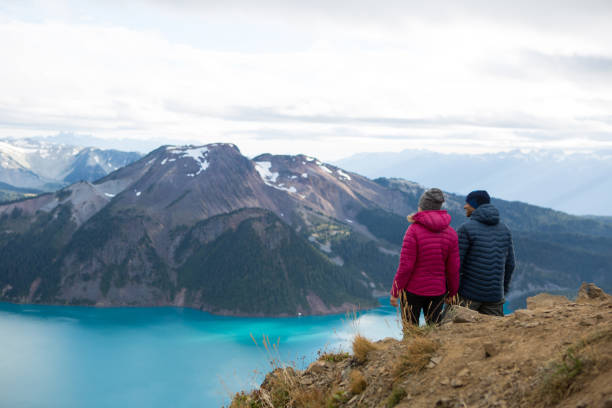 istock Young couple admire the view on their hike 861797608