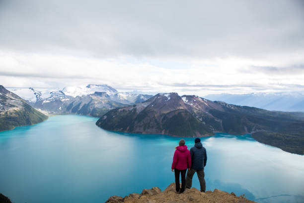 istock Couple embracing nature and the view 861798546