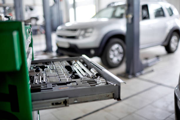 istock Extended drawer with tools in focus on the background of the car 861803786