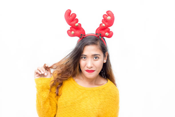 istock Smiling pretty student in reindeer antler headband 861804904