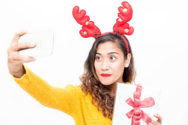 istock Smiling woman posing for selfie with gift 861804942