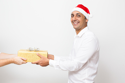 Classy guy giving a present to someone isolated on white background