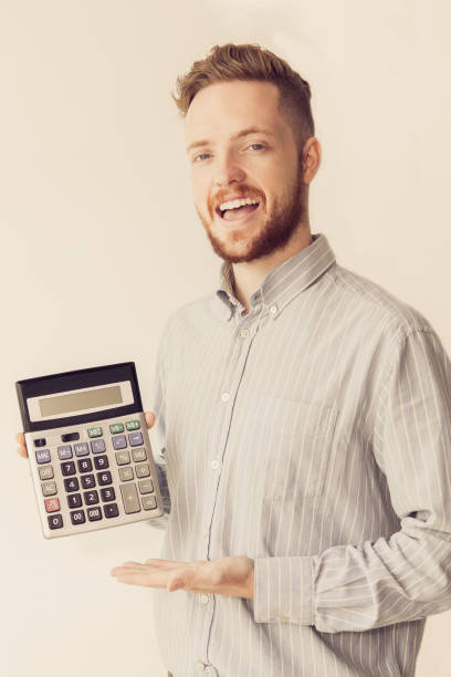 istock Happy young broker showing profit on calculator 861810752