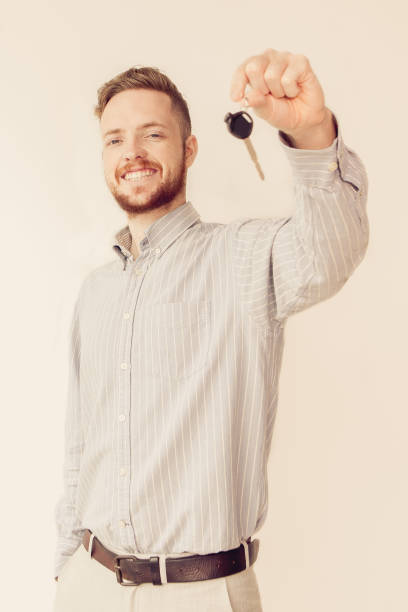 istock Happy sales manager holding car or house key 861810794