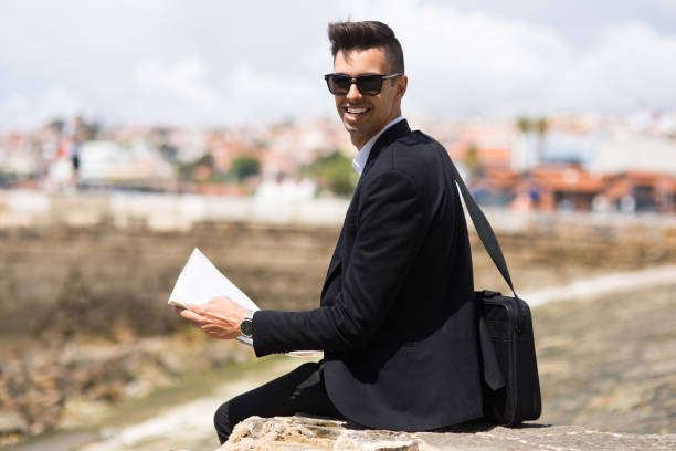 istock Cheerful young businessman travelling alone 861814424