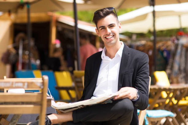 istock Cheerful handsome businessman resting outside cafe 861814426