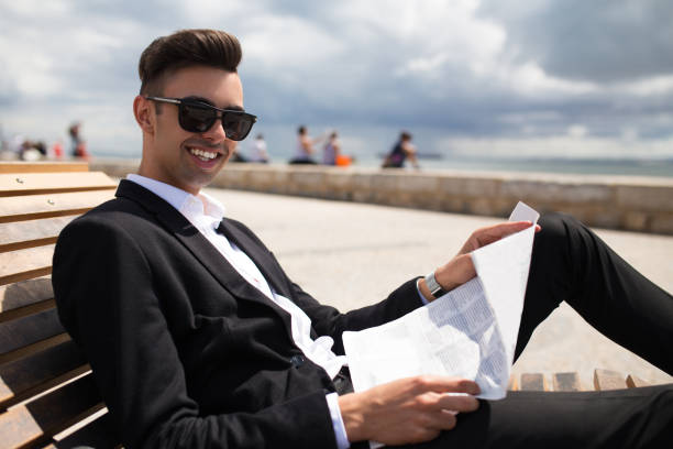 istock Happy handsome man interested in last news 861814442