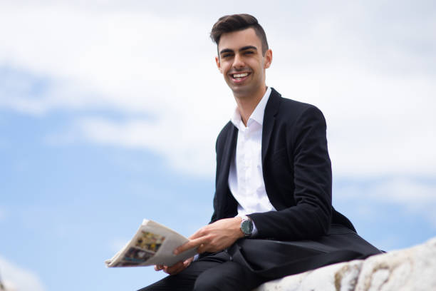istock Laughing handsome guy looking at camera outdoors 861814462